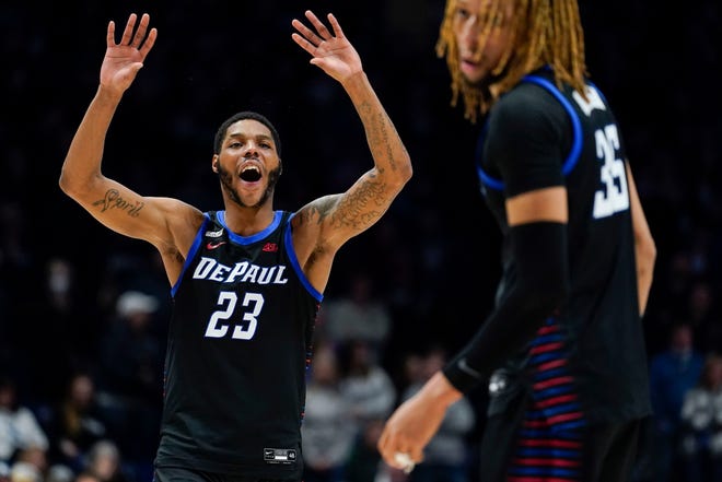 DePaul guard Courvoisier McCauley (23) reacts after Brandon Johnson (35) scores on a free-throw during the second half of an NCAA college basketball game, Saturday, Feb. 5, 2022, in Cincinnati. (AP Photo/Jeff Dean)