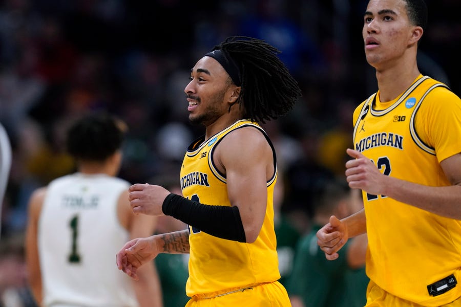 Michigan guard Frankie Collins celebrates during the second half of a college basketball game against Colorado State in the first round of the NCAA tournament in Indianapolis, Thursday, March 17, 2022. (AP Photo/Michael Conroy)