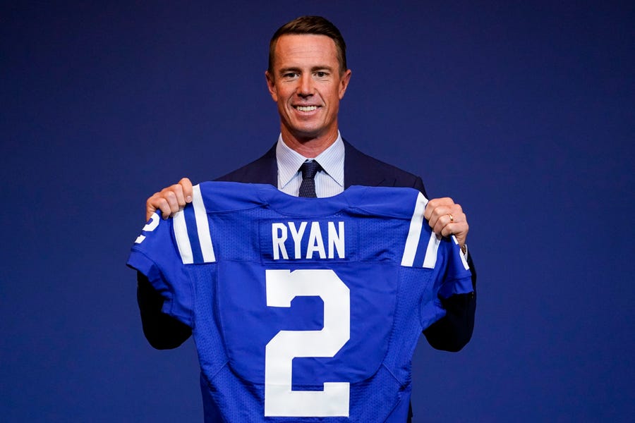 Indianapolis Colts quarterback Matt Ryan holds his new jersey following a press conference at the NFL team's practice facility in Indianapolis, Tuesday, March 22, 2022. (AP Photo/Michael Conroy)
