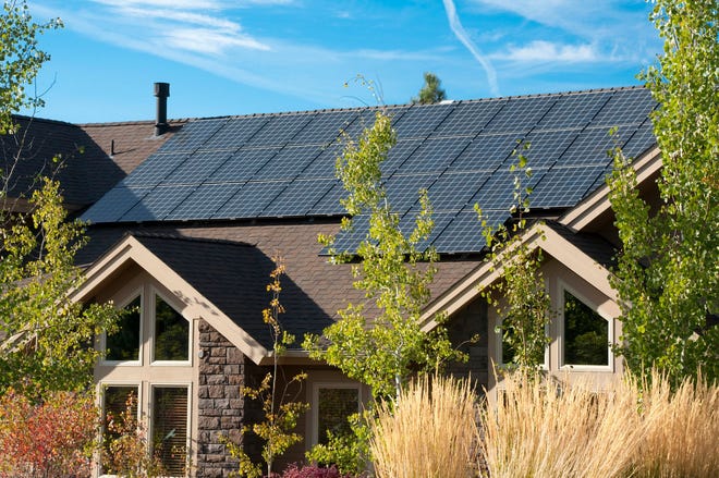 Solar panels on a large home.