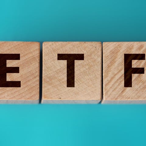Wooden blocks spelling out "ETF."