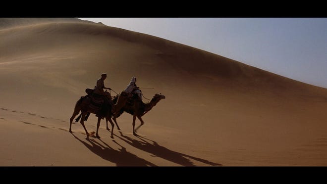 Sir David Lean's enduring classic "Lawrence of Arabia" rings in at nearly four hours, and was presented as a two-part film with an intermission between reels so moviegoers could get up and refresh themselves. Movie experts, some recalling those days fondly, say that tradition is never coming back.