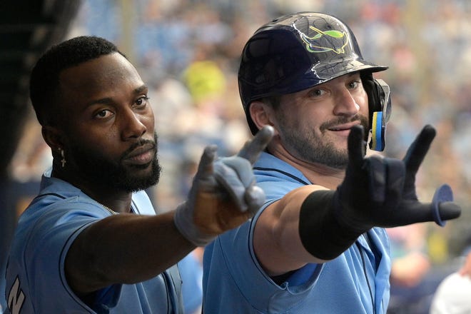 Tampa Bay Rays' Randy Arozarena, left, and Mike Zunino celebrate in front of a broadcast camera after Zunino hit a two-run home run, also scoring Arozarena, during the sixth inning of a baseball game against the Chicago White Sox, Sunday, June 5, 2022, in St. Petersburg, Fla. (AP Photo/Phelan M. Ebenhack)