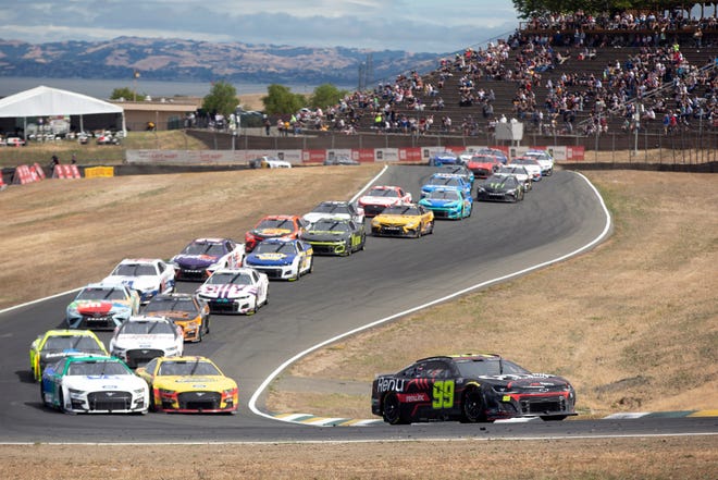 Daniel Suarez  leads the pack at Sonoma Raceway, where he became a first-time Cup Series winner.