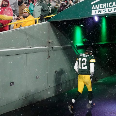 FILE - Green Bay Packers' Aaron Rodgers leaves the