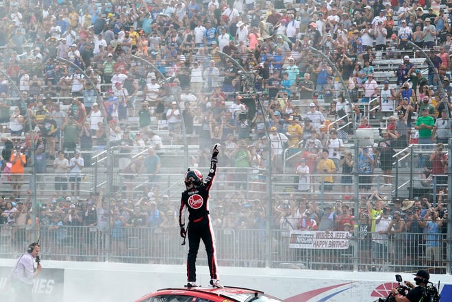 Christopher Bell celebrates after winning a NASCAR Cup Series auto race at the New Hampshire Motor Speedway, Sunday, July 17, 2022, in Loudon, NH (AP Photo/Charles Krupa)