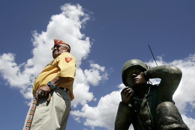 Navajo Code Talker Samuel Sandoval of Shiprock, N.M., poses during the unveiling of the Oreland C. Joe Code Talker sculpture at the Navajo Nation Fairgrounds in Window Rock, Ariz. Sandoval died Friday at 98.