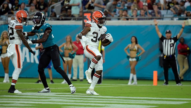 Cleveland Browns running back Jerome Ford (34) scores a touchdown against the Jacksonville Jaguars during the first half of an NFL preseason football game, Friday, Aug. 12, 2022, in Jacksonville, Fla. (AP Photo/Phelan M. Ebenhack)