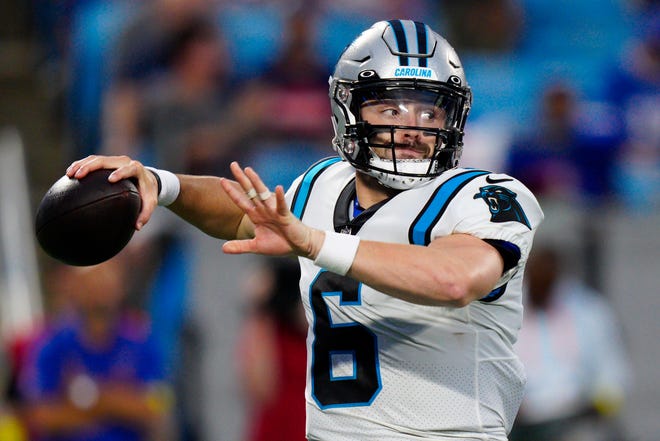 Carolina Panthers quarterback Baker Mayfield passes against the Buffalo Bills during the first have of an NFL preseason football game on Friday, Aug. 26, 2022, in Charlotte, N.C. (AP Photo/Jacob Kupferman)