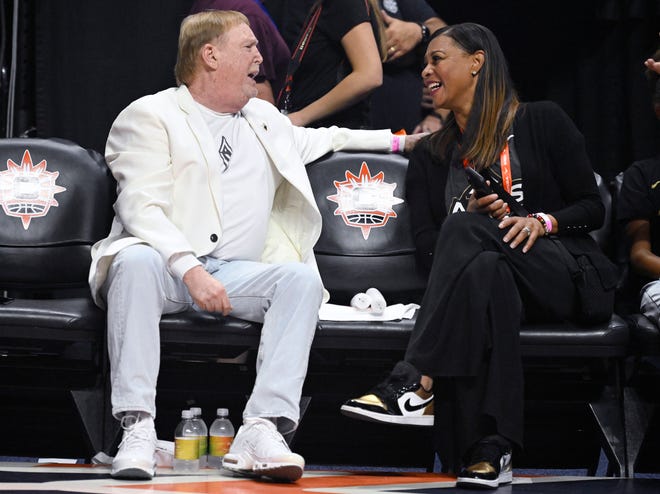 Las Vegas Aces owner Mark Davis, left, speaks with Aces president Nikki Fargas before Game 4 of a WNBA basketball playoff final series against the Connecticut Sun on Sunday, Sept. 18, 2022 in Uncasville, Conn. (AP Photo/Jessica Hill)