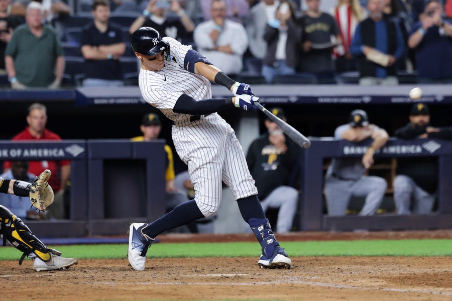 New York Yankees' Aaron Judge hits his 60th home run of the season, during the ninth inning of the team's baseball game against the Pittsburgh Pirates on Tuesday, Sept. 20, 2022, in New York. (AP Photo/Jessie Alcheh)