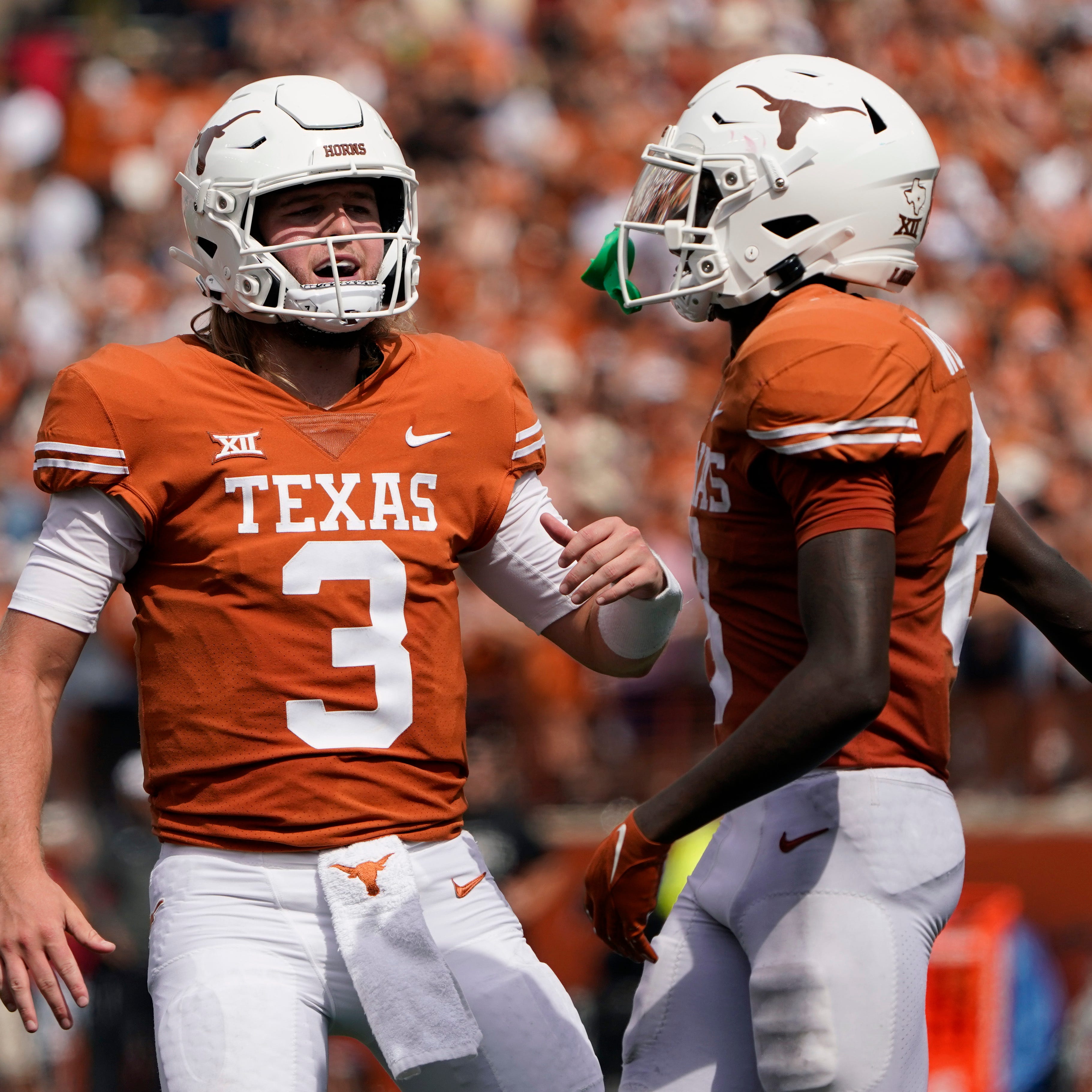 Texas quarterback Quinn Ewers (3) and wide receiver Xavier Worthy (8) celebrate after they connected on a touchdown pass against Iowa State during their game in 2022.