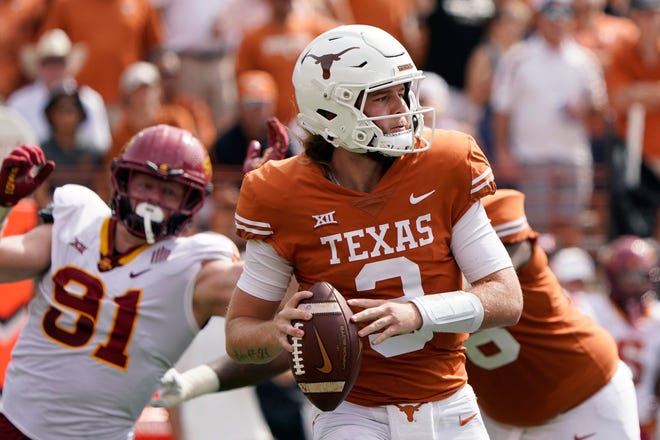 Texas quarterback Quinn Ewers (3) looks to pass against Iowa State during the first half of an NCAA college football game, Saturday, Oct. 15, 2022, in Austin, Texas. (AP Photo/Eric Gay)