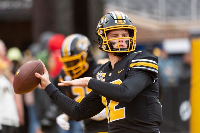 Missouri quarterback Brady Cook warms up before the start of an NCAA college football game against Kentucky Saturday, Nov. 5, 2022, in Columbia, Mo. (AP Photo/L.G. Patterson)