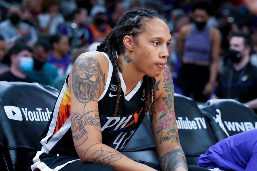 FILE - Phoenix Mercury center Brittney Griner sits during the first half of Game 2 of basketball's WNBA Finals against the Chicago Sky, Wednesday, Oct. 13, 2021, in Phoenix. Brittney Griner said she's "grateful" to be back in the United States and plans on playing basketball again next season for the WNBA's Phoenix Mercury a week after she was released from a Russian prison and freed in a dramatic high-level prisoner exchange. "It feels so good to be home!" Griner posted to   Instagram on Friday, Dec. 16, 2022, in her first public statement since her release. (AP Photo/Rick Scuteri, File)