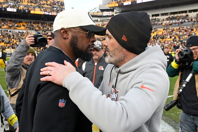 Pittsburgh Steelers head coach Mike Tomlin, left, and Cleveland Browns head coach Kevin Stefanski meet on the field following an NFL football game in Pittsburgh, Sunday, Jan. 8, 2023. The Steelers won 28-14. (AP Photo/Don Wright)