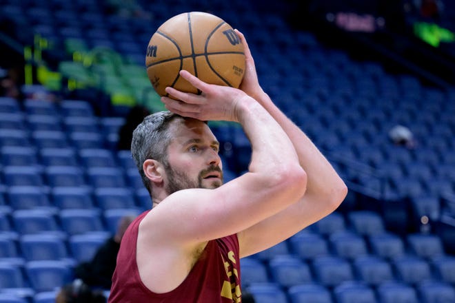 Cleveland Cavaliers forward Kevin Love warms up before an NBA basketball game against the New Orleans Pelicans in New Orleans, Friday, Feb. 10, 2023. (AP Photo/Matthew Hinton)