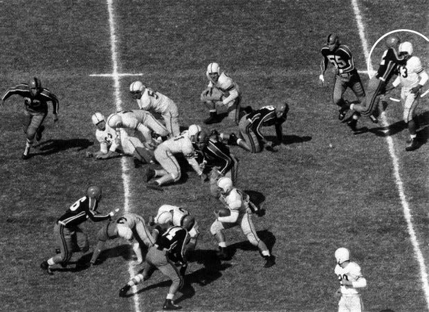 No. 6 of a six photograph sequence of the "Johnny Bright Incident", during a college football game between Oklahoma A&M and Drake on Oct. 20, 1951 in Stillwater, Okla. The sequence of photos taken by Des Moines Register photographers John Robinson and Don Ultang shows Oklahoma A&M player Wilbanks Smith's jaw-breaking blow was thrown well after Drake's Johnny Bright had handed the ball off to fullback Gene Macomber, and was well behind the play. The photographic sequence recording the incident won Robinson and Ultang the 1952 Pulitzer Prize.