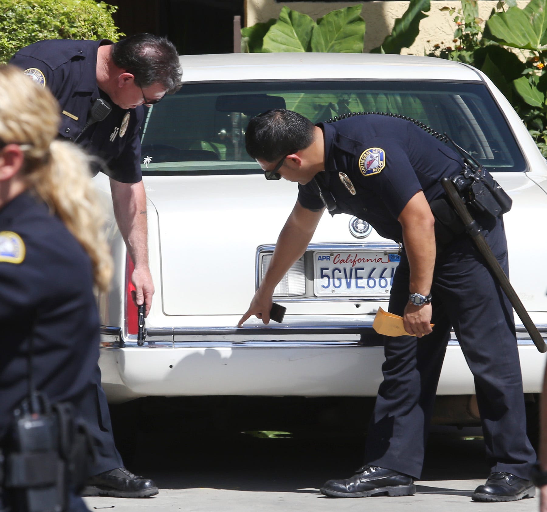 Cathedral City police investigate bullet holes in the rear of a car after a drive-by shooting in the 33-500 block of Wishing Well Trail in 2014.