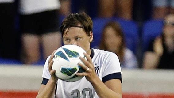 United States' Abby Wambach kisses a soccer ball after scoring against South Korea during the first half of an international friendly soccer match at Red Bull Arena, Thursday, June 20, 2013, in Harrison, N.J. With the goal, Wambach broke Mia Hamm's national goal-scoring record. (AP Photo/Julio Cortez)