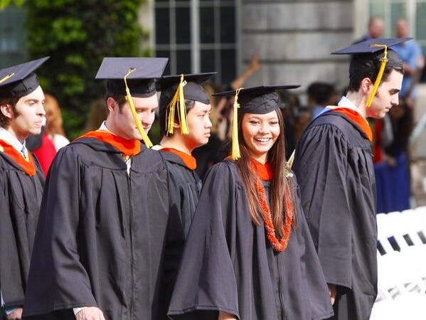 
UR Students are all smiles as they locate their families in the crowd at commencement.
