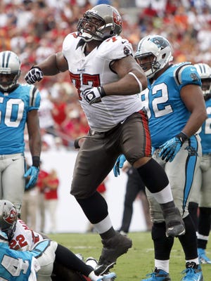 Tampa Bay Buccaneers guard Carl Nicks (77) celebrates after a play against the Carolina Panthers during the first half at Raymond James Stadium in Week 1.