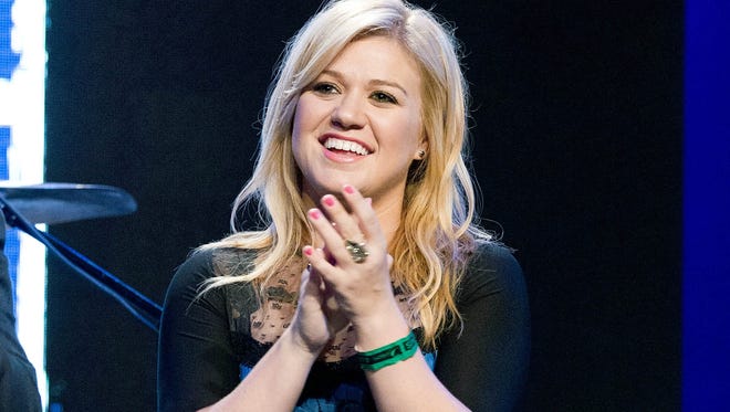 Kelly Clarkson at the Pepsi NFL anthems kick off at Hard Rock Cafe in New York