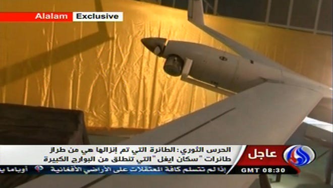 This image taken from the Iranian state TV's Arabic-language channel Al-Alam shows what Iran purports to be an intact ScanEagle drone aircraft.