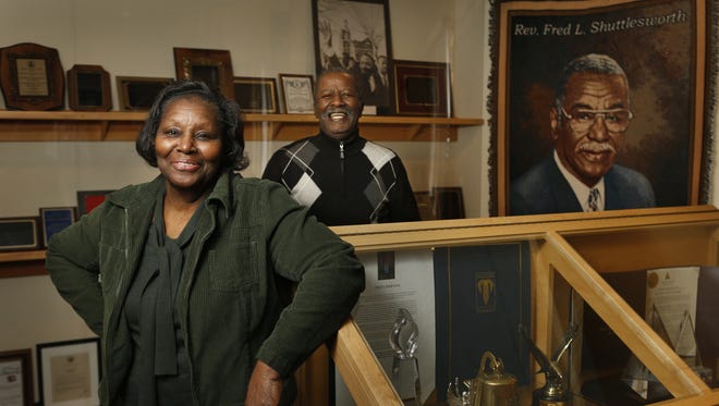 Pat Massengill, oldest daughter of the late civil rights leader Rev. Fred Shuttlesworth, and Fred Shuttlesworth, Jr., the reverend's son, stand amid some of their father's awards and commemorative pieces at the Greater New Light Baptist Church in Avondale, Ohio, on Jan. 31, 2013.