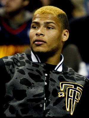 Former Louisiana State cornerback Tyrann Mathieu watches courtside during   a game between the New Orleans Hornets and the Golden State Warriors at the New Orleans Arena on Jan. 19, 2013.
