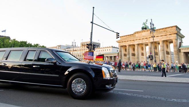 The limousine carrying President Obama drives by the Brandenburg Gate after his arrival in Berlin on Tuesday.