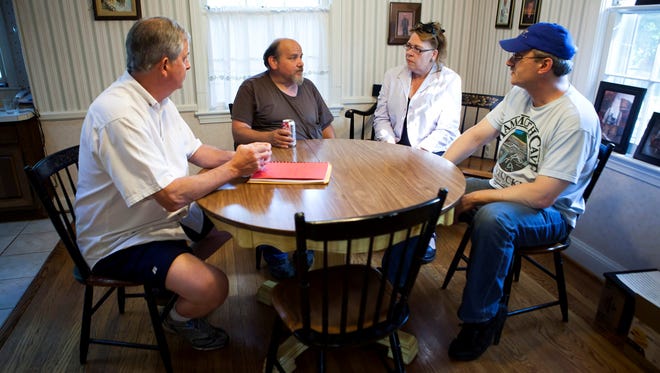 Cal Pfeiffer, from left, Jeff Koenig, Jeanette Westbrook, and Warren Tucker gather June 8 for a meeting of the Louisville (Ky.) chapter of Survivors Network of those Abused by Priests.