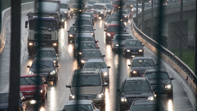 Cars stuck in a traffic jam on the city highway A100 as heavy rain falls on Berlin on May 31.
