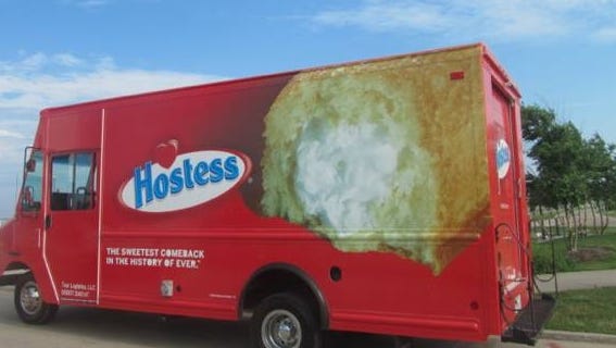 Hostess promoters will drive food trucks, and dole out free Twinkies, to mark the return of the snack cake to store shelves on July 15.