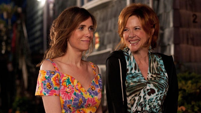 Kristen Wiig, left, stars as a failed playwright who must move back in with her mother, played by Annette Bening, in 'Girl Most Likely.'
