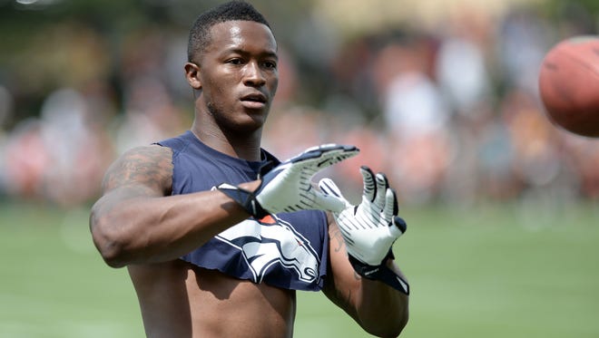 Denver Broncos wide receiver Demaryius Thomas gets in some extra work after practice on July 27, 2013.