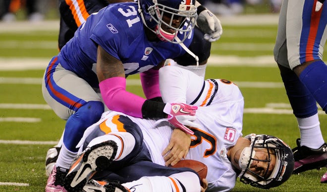 New York Giants cornerback Aaron Ross (31) sacks Chicago Bears quarterback Jay Cutler (6)  on Oct. 3, 2010. Cutler suffered a concussion during the game.