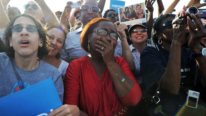 Supporters listen to US President Barack Obama during a campaign rally in Florida, on November 4, 2012. O