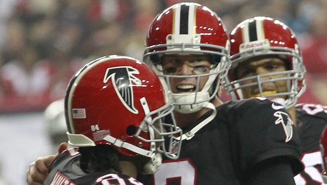 Falcons quarterback Matt Ryan celebrates a touchdown with Roddy White.