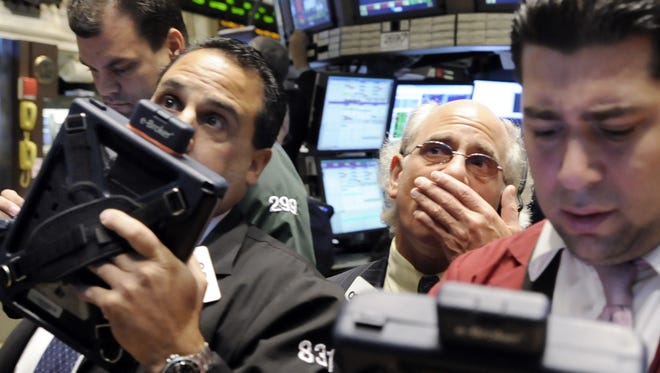 Traders react on the floor of New York Stock Exchange on  Oct. 30, 2008. 