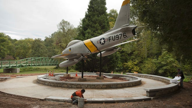 Alberto Salvador works on the renovation of a memorial for Maj. Rudolf Anderson in Greenville, S.C. Anderson, shot down while piloting a U-2, was the only casualty of the Cuban Missile Crisis 50 years ago.