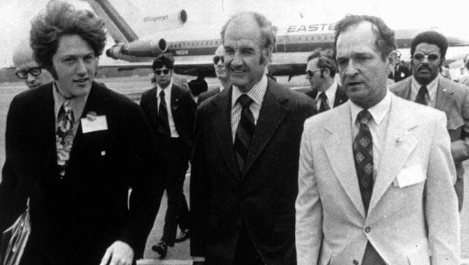 Sen. George McGovern, center, arrives in Little Rock, Ark., in early 1972, seeking support for his Democratic presidential nomination. He was met at the Little Rock Airport by Bill Clinton, left, then a McGovern campaign worker, and by Joe Purcell, then-chairman of the state Democratic Party. 