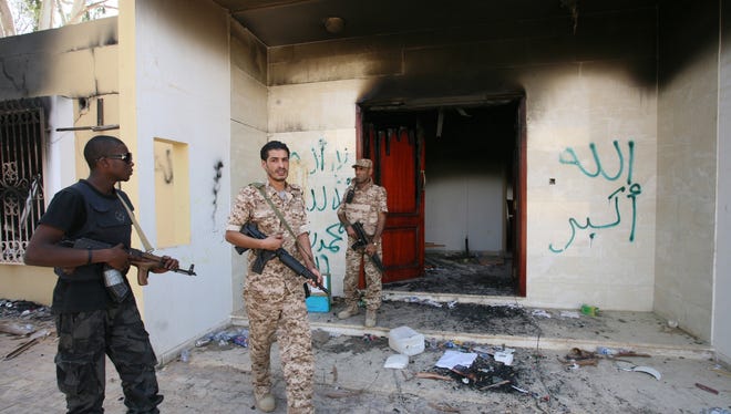 Libyan military guards check on the damaged U.S. Consulate in Benghazi on Sept. 14. 
