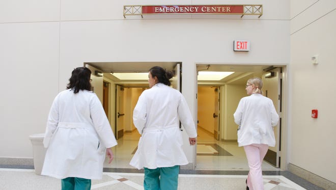 Doctors and a student respond to an emergency page at  Houston's Memorial Hermann Hospital in this file photo.