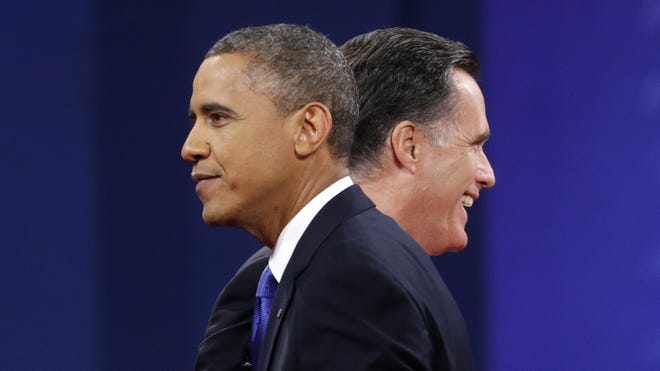 President Obama and Republican presidential candidate Mitt Romney are on stage together at the end of Monday night's last debate in Fla.
