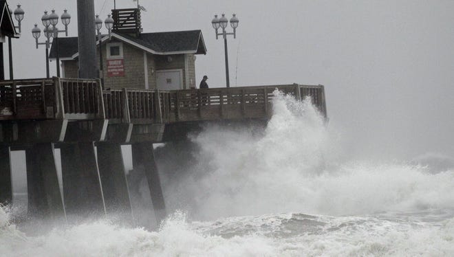 Large waves generated by Hurricane Sandy crash into Jeanette's Pier in Nags Head, N.C., on Saturday.