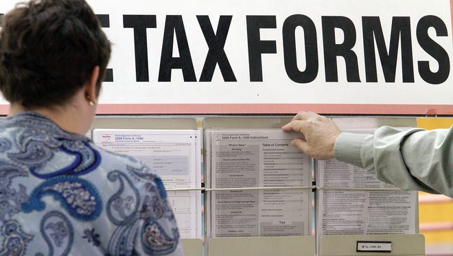 Taxpayers pick up forms in Illinois in April 2010.