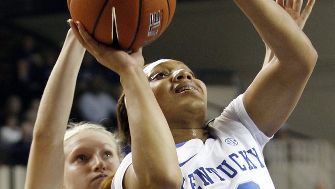 Kentucky's Bernisha Pinkett (10) shoots in front of Miami (Ohio) guard Courtney Larson (14) during the first half of an NCAA college basketball game at Memorial Coliseum in Lexington, Ky., Wednesday, Nov. 28, 2012.