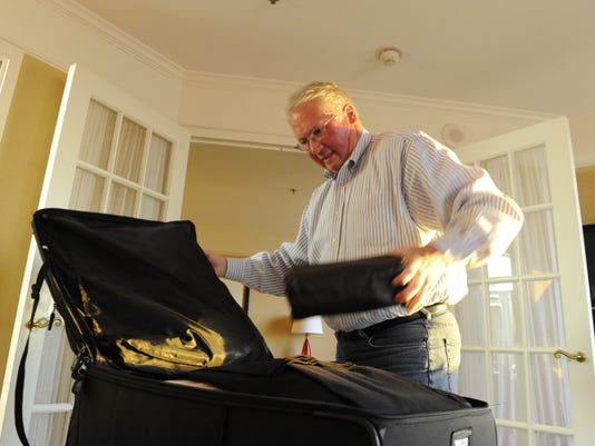 Packing suitcase Bob Johnson