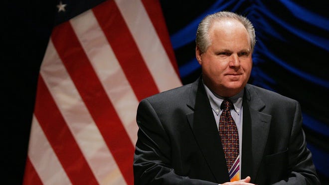 Radio personality Rush Limbaugh speaks to an audience in 2006 in Washington. In his radio show, Limbaugh on Monday charged that the "media, Democrats and leftists" were using the Connecticut killings to advance their political agenda against Republicans and conservative values.